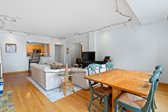 431 S Dearborn St Unit 1303, Chicago, IL 60605 - living area with track lighting and light wood-style floors