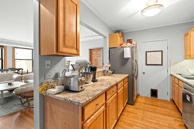 431 S Dearborn St Unit 1303, Chicago, IL 60605 - kitchen with stainless steel appliances, light wood-style floors, crown molding, tasteful backsplash, and light stone countertops