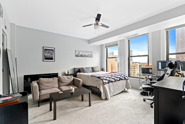431 S Dearborn St Unit 1303, Chicago, IL 60605 - bedroom featuring a desk, light colored carpet, multiple windows, and ceiling fan