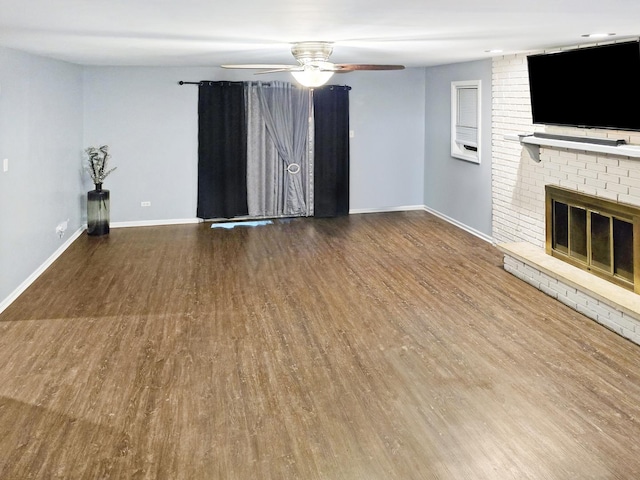 301 Cornell Ave, Calumet City, IL 60409 - unfurnished living room featuring wood finished floors, ceiling fan, and a brick fireplace