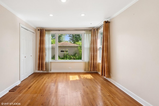 3837 Kirk St, Skokie, IL 60076 - unfurnished bedroom featuring crown molding, light wood-type flooring, a closet, and recessed lighting