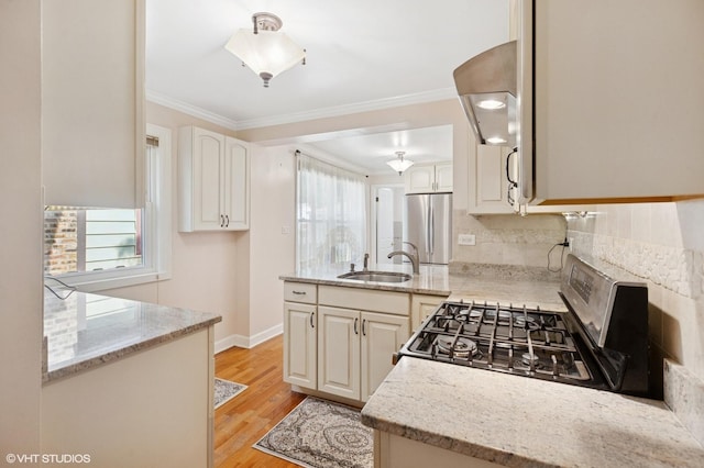 3837 Kirk St, Skokie, IL 60076 - kitchen featuring appliances with stainless steel finishes, decorative backsplash, light stone counters, light wood-style flooring, and crown molding