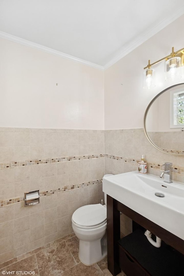3837 Kirk St, Skokie, IL 60076 - bathroom with ornamental molding, vanity, and tile walls