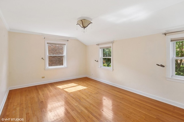 3837 Kirk St, Skokie, IL 60076 - spare room with hardwood / wood-style flooring and vaulted ceiling