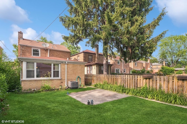 3837 Kirk St, Skokie, IL 60076 - back of property with brick siding, a patio area, and a chimney