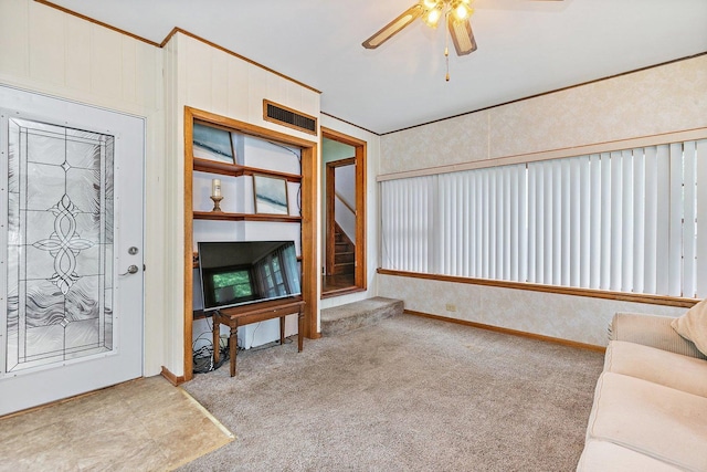 218 Mason Ct, Sycamore, IL 60178 - unfurnished living room featuring a ceiling fan, carpet, and stairs