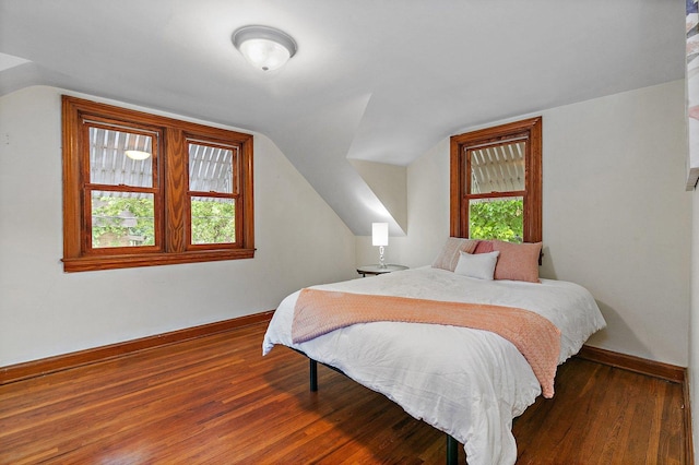218 Mason Ct, Sycamore, IL 60178 - bedroom with multiple windows, vaulted ceiling, and wood finished floors