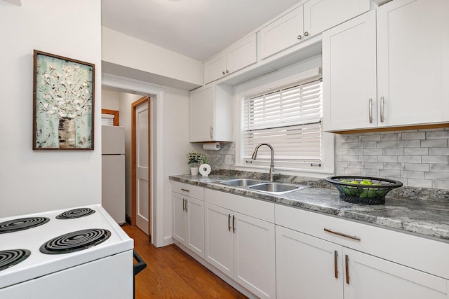218 Mason Ct, Sycamore, IL 60178 - kitchen with white appliances, backsplash, and white cabinetry