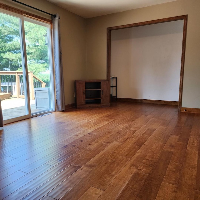 1932 N 2653rd Rd, Ottawa, IL 61350 - unfurnished living room with hardwood / wood-style floors and baseboards