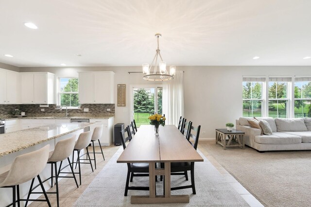 9054 Clinnin Ln, Huntley, IL 60142 - dining room with a chandelier, recessed lighting, and light tile patterned floors