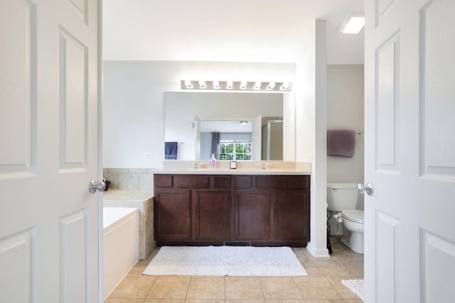 9054 Clinnin Ln, Huntley, IL 60142 - bathroom featuring a bath, double vanity, a stall shower, and tile patterned flooring