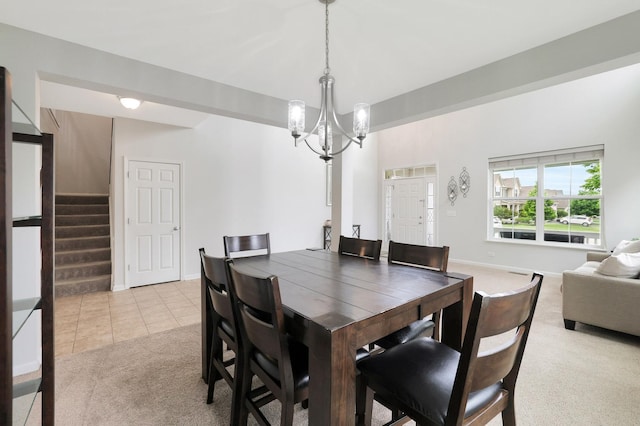 9054 Clinnin Ln, Huntley, IL 60142 - dining space with light carpet, a chandelier, stairs, and light tile patterned floors