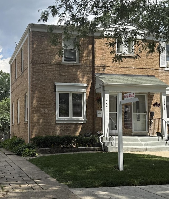 1757 Linden St, Des Plaines, IL 60018 - view of front of home with brick siding and a front lawn