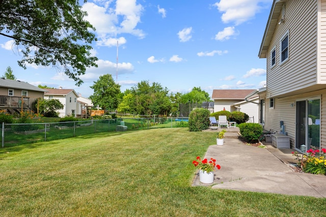 1558 Oregon Trl, Elk Grove Village, IL 60007 - fenced backyard with a trampoline, a patio, and a residential view