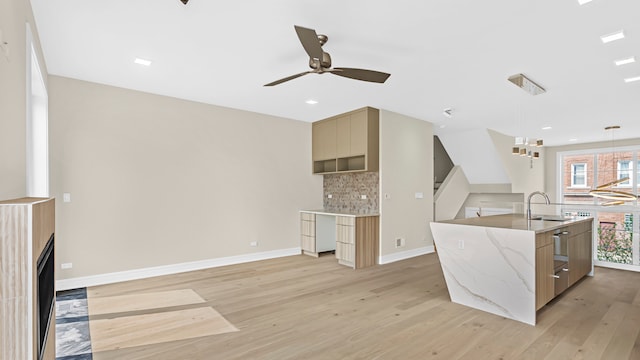 336 E Pershing Rd, Chicago, IL 60653 - kitchen featuring modern cabinets, backsplash, light wood-style floors, a ceiling fan, and recessed lighting
