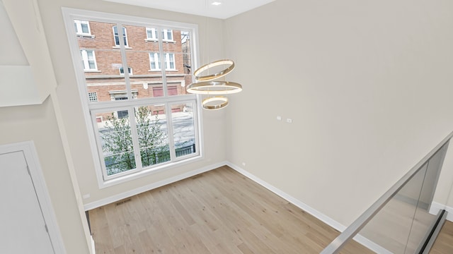 336 E Pershing Rd, Chicago, IL 60653 - empty room with light wood-style floors and baseboards