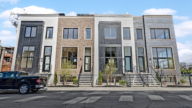 336 E Pershing Rd, Chicago, IL 60653 - multi unit property with a fenced front yard, brick siding, and entry steps