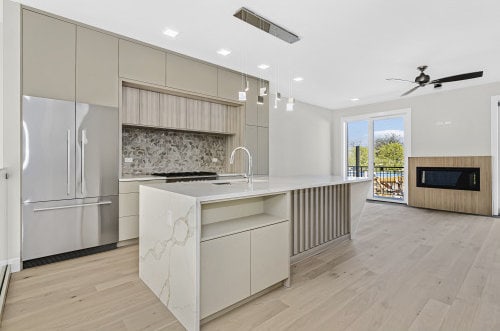 336 E Pershing Rd, Chicago, IL 60653 - kitchen featuring high quality fridge, modern cabinets, decorative backsplash, light countertops, and recessed lighting