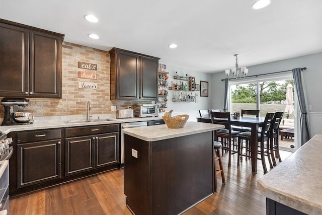 956 Tuscany Trl, Hampshire, IL 60140 - kitchen with stainless steel appliances, dark brown cabinets, dark wood-type flooring, a chandelier, and recessed lighting