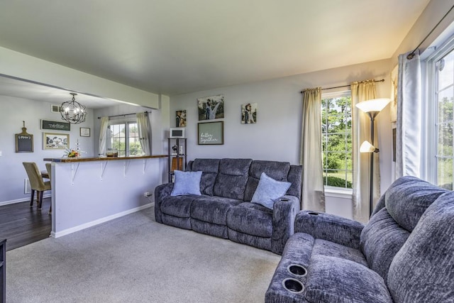 39709 N Warren Ln, Beach Park, IL 60083 - carpeted living area with a chandelier and baseboards