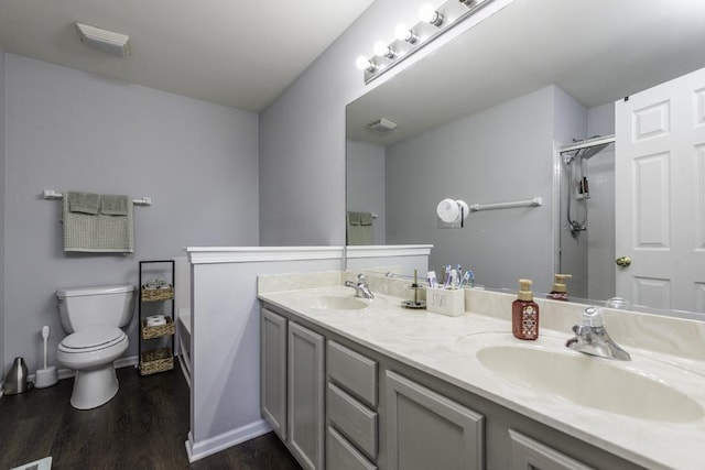 39709 N Warren Ln, Beach Park, IL 60083 - bathroom with double vanity, wood finished floors, tiled shower, and a bath