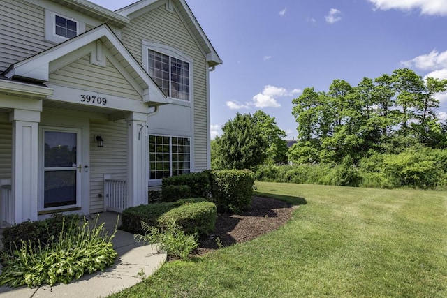 39709 N Warren Ln, Beach Park, IL 60083 - view of exterior entry with a lawn