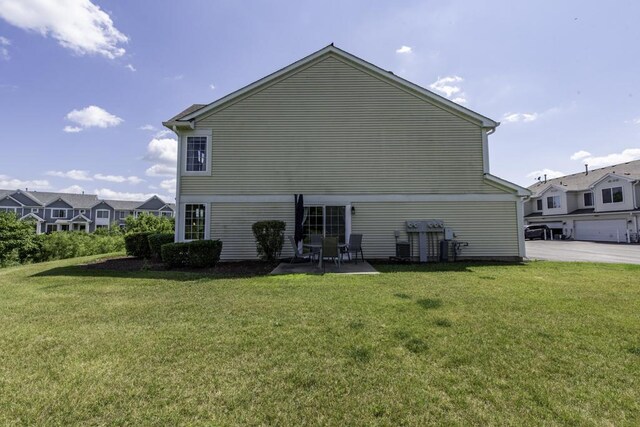 39709 N Warren Ln, Beach Park, IL 60083 - rear view of house with a yard and a patio area