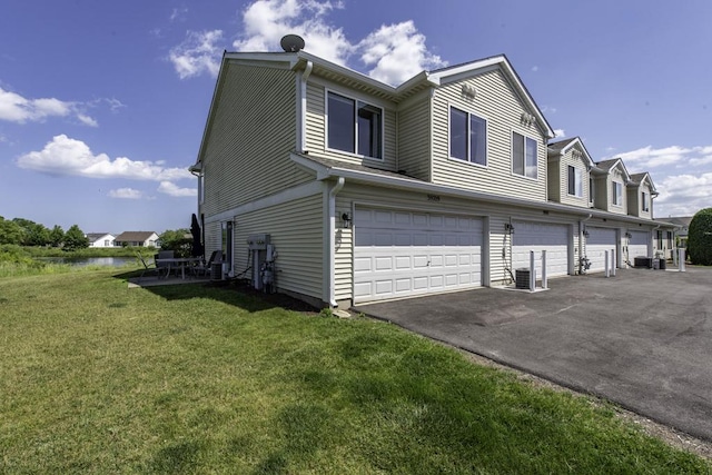 39709 N Warren Ln, Beach Park, IL 60083 - view of side of property featuring an attached garage, a yard, and driveway