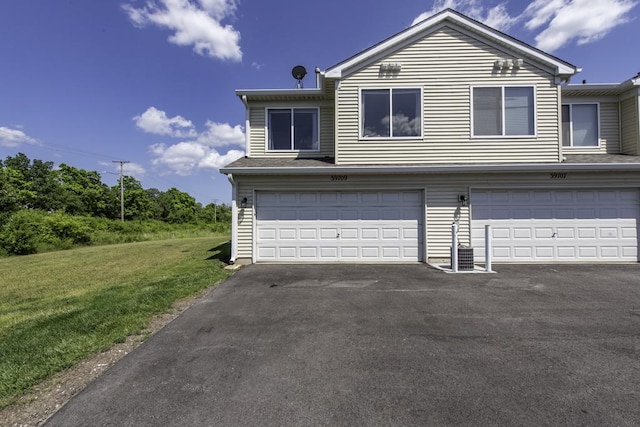 39709 N Warren Ln, Beach Park, IL 60083 - view of front of home with a garage, a front lawn, and driveway