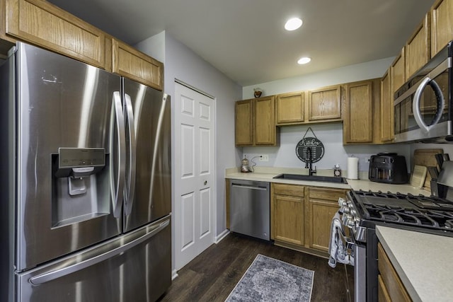 39709 N Warren Ln, Beach Park, IL 60083 - kitchen featuring stainless steel appliances, light countertops, brown cabinets, dark wood finished floors, and recessed lighting