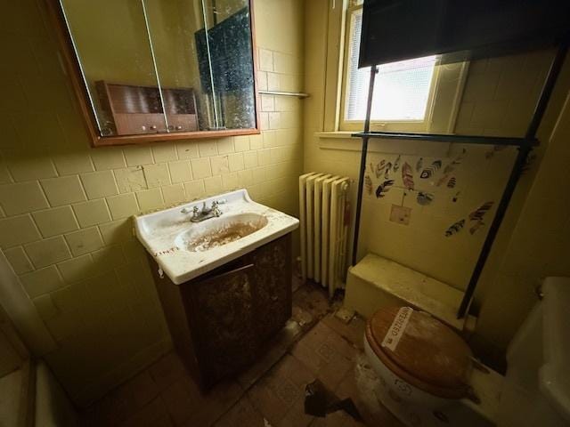 7806 S Avalon Ave, Chicago, IL 60619 - bathroom featuring radiator heating unit and vanity