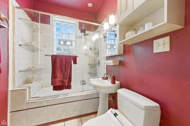 2240 S Avers Ave, Chicago, IL 60623 - bathroom featuring tiled shower / bath combo, plenty of natural light, and tile patterned flooring