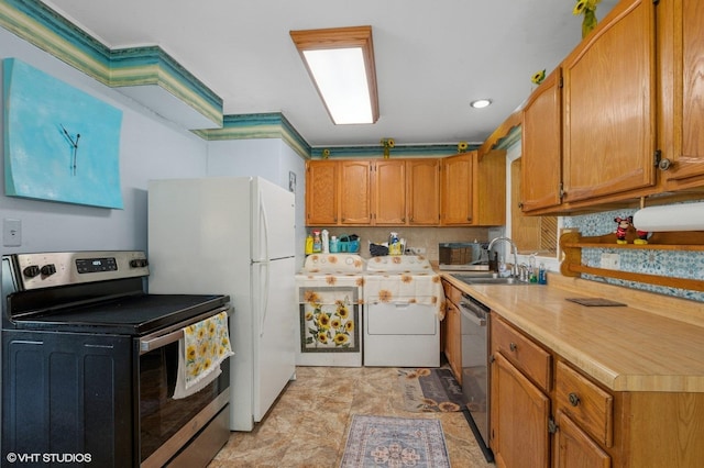 8937 Fairlane Dr, Bridgeview, IL 60455 - kitchen featuring appliances with stainless steel finishes, washer / clothes dryer, light countertops, and brown cabinetry