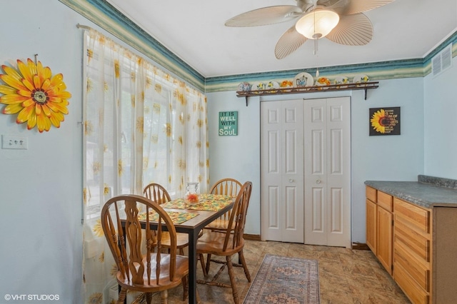8937 Fairlane Dr, Bridgeview, IL 60455 - dining room with a ceiling fan and stone finish flooring