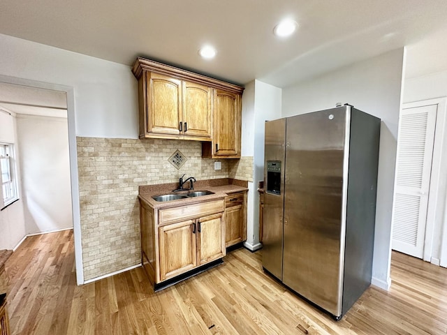 2111 N 75th Ct, Elmwood Park, IL 60707 - kitchen featuring stainless steel fridge, light wood-style floors, backsplash, and recessed lighting