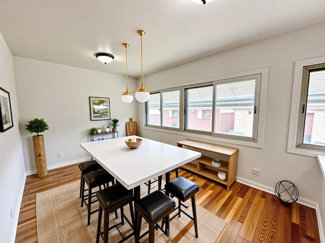 2111 N 75th Ct, Elmwood Park, IL 60707 - dining space featuring plenty of natural light and light wood-style floors
