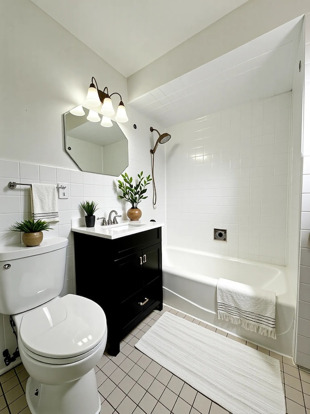 2111 N 75th Ct, Elmwood Park, IL 60707 - bathroom featuring vanity, tile patterned floors, tub / shower combination, and tile walls