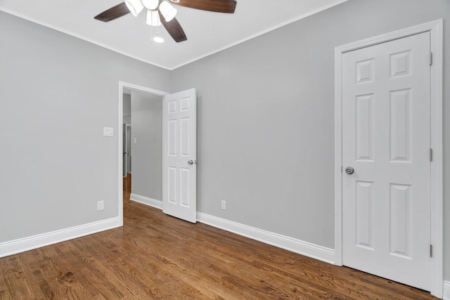 8107 S Princeton Ave, Chicago, IL 60620 - empty room with a ceiling fan, wood finished floors, and ornamental molding