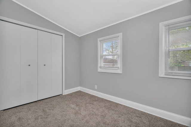8107 S Princeton Ave, Chicago, IL 60620 - unfurnished bedroom with lofted ceiling, ornamental molding, carpet, and a closet