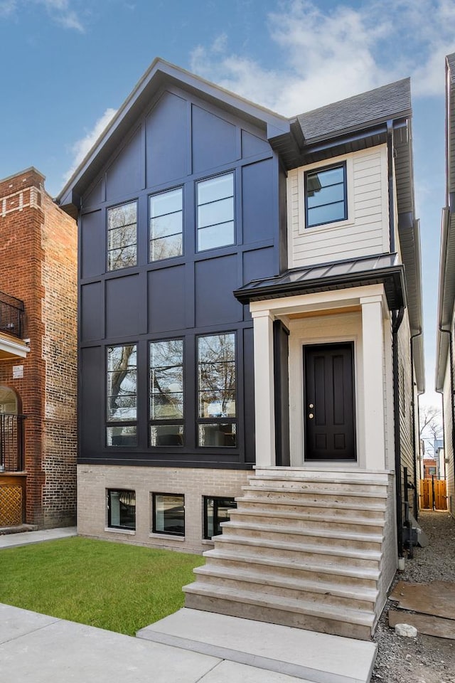 2137 W School St, Chicago, IL 60618 - view of front of home with a standing seam roof and a metal roof