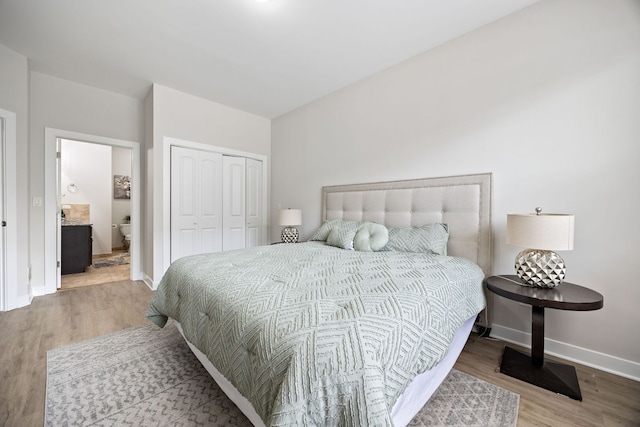 3130 W Walton St Unit 1, Chicago, IL 60622 - bedroom featuring wood finished floors, a closet, and ensuite bathroom