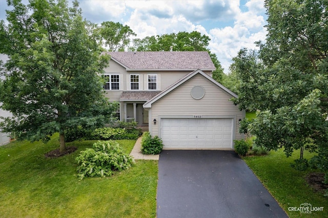 3402 Hoffman St, Plano, IL 60545 - view of front facade with driveway, a front yard, roof with shingles, and a garage