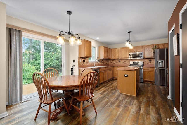 3402 Hoffman St, Plano, IL 60545 - dining area with dark wood-style flooring, a chandelier, and recessed lighting