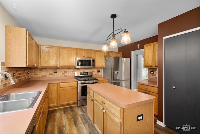 3402 Hoffman St, Plano, IL 60545 - kitchen with stainless steel appliances, dark wood-type flooring, decorative backsplash, light countertops, and a center island