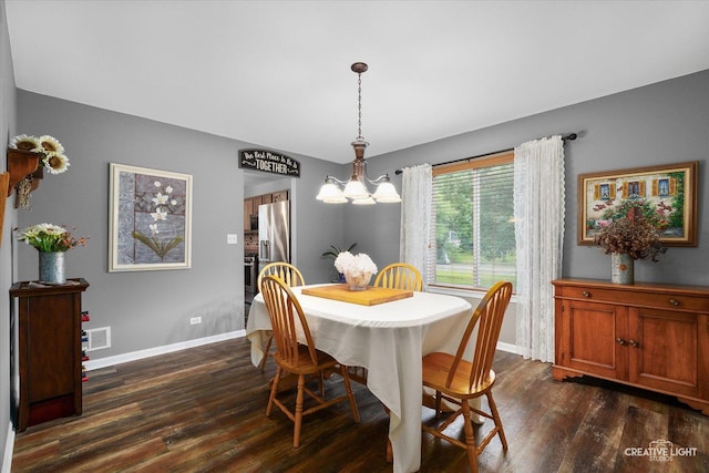 3402 Hoffman St, Plano, IL 60545 - dining space featuring dark wood-type flooring and a chandelier