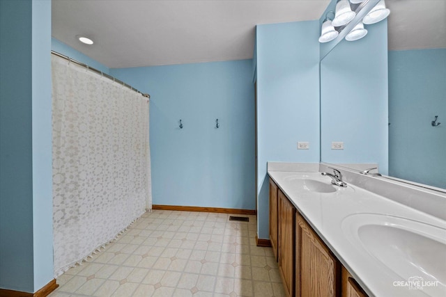 3402 Hoffman St, Plano, IL 60545 - full bathroom featuring double vanity, tile patterned floors, and a shower with shower curtain