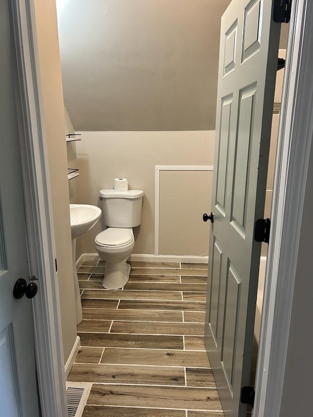 2122 N Lorel Ave, Chicago, IL 60639 - bathroom with toilet and wood finished floors