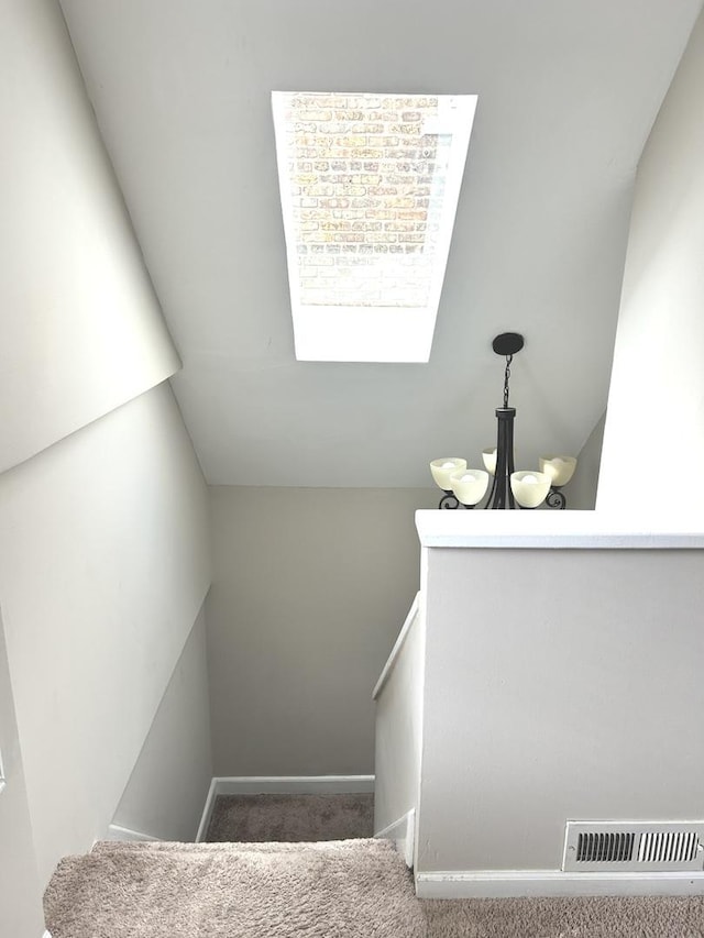 2122 N Lorel Ave, Chicago, IL 60639 - stairs featuring carpet and a chandelier