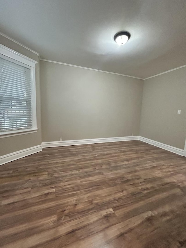 2122 N Lorel Ave, Chicago, IL 60639 - unfurnished room featuring crown molding and dark wood-type flooring