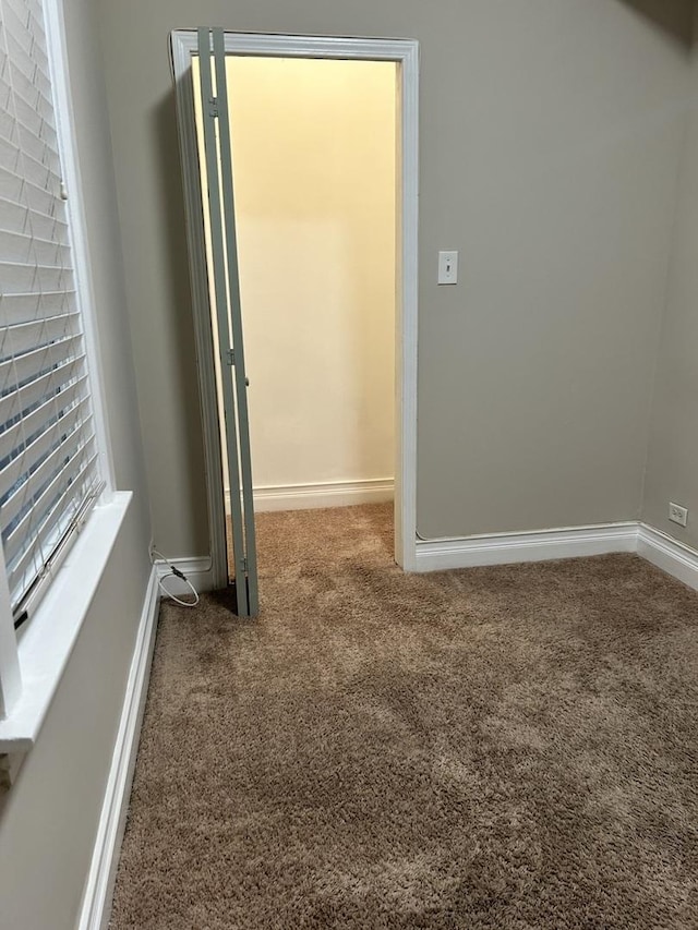2122 N Lorel Ave, Chicago, IL 60639 - empty room with carpet floors and baseboards